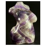 Divine Feminine Amethyst Chevron is a beautifully patterned crystal that combines the deep purple of amethyst with milky white quartz in distinctive V-shaped chevron banding.