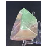 Fluorite Leaf Dish is a hand-carved crystal piece shaped like a delicate leaf bowl, showcasing the natural banding and vibrant colors of fluorite.