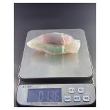 Fluorite Leaf Dish is a hand-carved crystal piece shaped like a delicate leaf bowl, showcasing the natural banding and vibrant colors of fluorite.