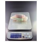 Fluorite Leaf Dish is a hand-carved crystal piece shaped like a delicate leaf bowl, showcasing the natural banding and vibrant colors of fluorite.