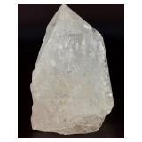 Quartz Point - Golden Healer is a striking crystal featuring clear quartz accented with subtle golden tones from natural iron inclusions, known as Golden Healer.