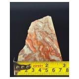 Crazy Lace Agate is a vibrant and eye-catching crystal known for its intricate, swirling patterns and lively mix of colors, typically including creamy whites, warm reds, oranges, and browns.