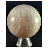 Blue Quartz Sphere is a polished crystal sphere that showcases the calming, ethereal beauty of blue quartz.
