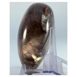 Large Smoky Quartz Heart with Rainbows & Inclusions is a striking, hand-polished crystal heart. The rich, earthy tones of smoky quartz along with natural internal inclusions that create captivatin