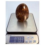 Brown Quartzite Freeform is a naturally shaped, polished stone that highlights the earthy, warm tones and subtle striations of quartzite.