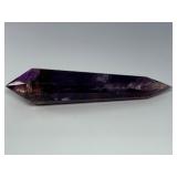 Extra Large Amethyst Vogel Double Terminated is a powerful and visually striking crystal, expertly carved into the iconic Vogel shape with pointed terminations at both ends.