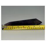 Extra Large Amethyst Vogel Double Terminated is a powerful and visually striking crystal, expertly carved into the iconic Vogel shape with pointed terminations at both ends.