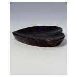 Arfvedsonite Heart Dish is a beautifully hand-carved crystal dish shaped like a heart, showcasing the deep, inky blue-black tones and striking natural patterns of arfvedsonite.