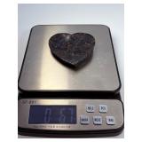 Arfvedsonite Heart Dish is a beautifully hand-carved crystal dish shaped like a heart, showcasing the deep, inky blue-black tones and striking natural patterns of arfvedsonite.