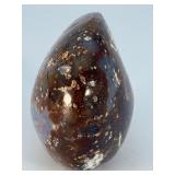 Orbs Ocean Jasper Palm Stone is a smooth, hand-polished crystal shaped to fit comfortably in the palm, showcasing the signature orb-like patterns and soothing earthy tones of ocean jasper.