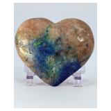Azurite Malachite in Quartz Heart is a beautifully hand-carved crystal heart that combines the vibrant blue of azurite, the rich green of malachite, and the clear brilliance of quartz.