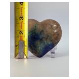 Azurite Malachite in Quartz Heart is a beautifully hand-carved crystal heart that combines the vibrant blue of azurite, the rich green of malachite, and the clear brilliance of quartz.