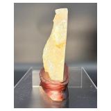 A radiant Golden Healer quartz that shimmers with warm, honey-gold hues and soft natural phantoms.  with custom wooden stand from Brazil
