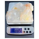 A radiant Golden Healer quartz that shimmers with warm, honey-gold hues and soft natural phantoms.  with custom wooden stand from Brazil