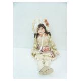 Porcelain Doll. Sits 17.5" tall
