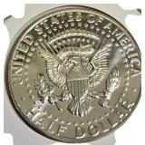 1964 John F. Kennedy Half Dollar, MS-69 grade, featuring the Heavy Accented Hair variant.