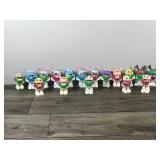 Lot of 17 Collectible Mini M&M Figurines (None of them have been opened - they still have candy and plastic wrapped around them)