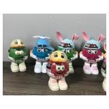 Lot of 17 Collectible Mini M&M Figurines (None of them have been opened - they still have candy and plastic wrapped around them)
