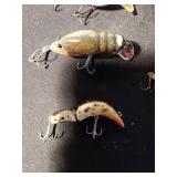 8 fishing lures including 1 wooden lure (See Details)