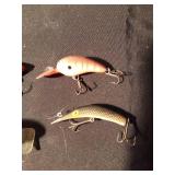 8 fishing lures including 1 wooden lure (See Details)