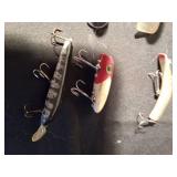 8 fishing lures including 1 wooden lure (See Details)