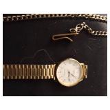 4 wrist watches and a pocket watch