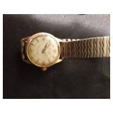 4 wrist watches and a pocket watch