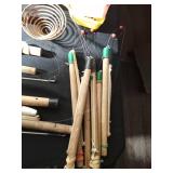 Bucket of vintage ice fishing sticks, reels and more