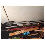 Bucket of vintage ice fishing sticks, reels and more