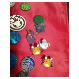 Lot of Pokemon trading coins and pins