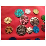 Lot of Pokemon trading coins and pins