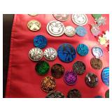Lot of Pokemon trading coins and pins