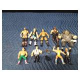 Vintage wrestling figurines and 2 toy wrestling belts
