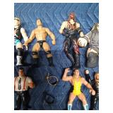 Vintage wrestling figurines and 2 toy wrestling belts