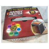 New Handy Heater Pure Warmth Ceramic Space Heater with LED Lights