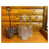 Antique Tantalus Set with Three Cut Glass Decanters and Silver-Plated Stand