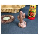 Collection of Vintage Souvenir Plates, Wicker Basket, Russian Nesting Doll, and Decorative Items