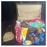 Vintage Suitcase with Assorted Silk Scarves and Tapestry Purse