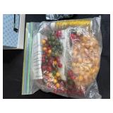 Collection of Assorted Craft Beads and Plastic Rings with Storage Box