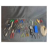 Collection of Hand Tools with Pliers, Files, Screwdrivers, and Magnifier
