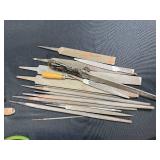 Collection of Hand Tools with Pliers, Files, Screwdrivers, and Magnifier