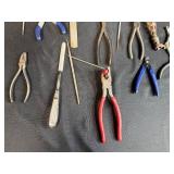 Collection of Hand Tools with Pliers, Files, Screwdrivers, and Magnifier