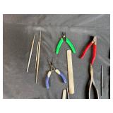 Collection of Hand Tools with Pliers, Files, Screwdrivers, and Magnifier