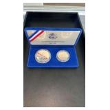 1986 90% Silver Dollar and clad half dollar commemorative set