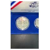 1986 90% Silver Dollar and clad half dollar commemorative set