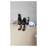 Collection of Beer Memorabilia including Schlitz Pitcher, Budweiser Mardi Gras 2001 Bottle, and Bad Habit Brewing Growler