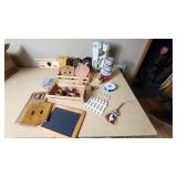 Assorted Craft and Home Decor Items including Wooden Wall Decorations, Ribbon Spools, and Garden Accessories