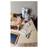 Assorted Craft and Home Decor Items including Wooden Wall Decorations, Ribbon Spools, and Garden Accessories