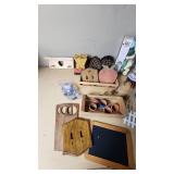 Assorted Craft and Home Decor Items including Wooden Wall Decorations, Ribbon Spools, and Garden Accessories