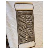 Antique Cast Iron Kitchenware Set including Corn Cob Pan, Spring Handle, and All-In-One Grater
